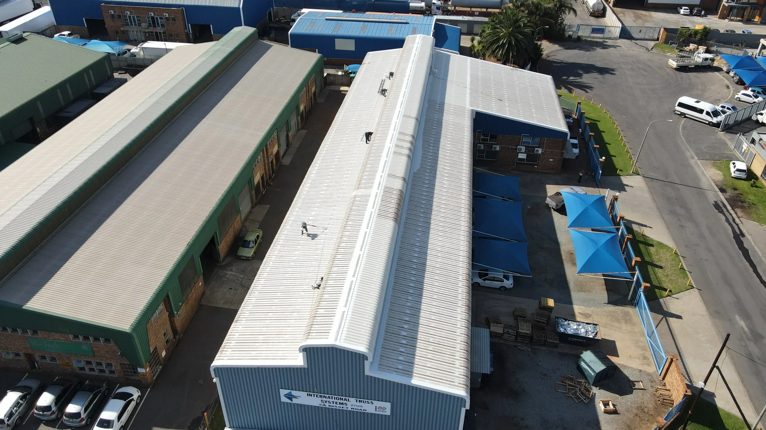 Sicon Group waterproofing specialists inspecting and preparing a commercial building roof in Johannesburg for waterproofing treatment